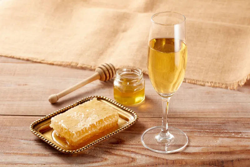 Image showing From Hive to Glass: service. Honey in a champagne glass.